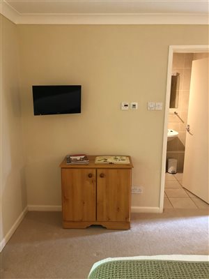 Room 5 superior tv cupboard en-suite door